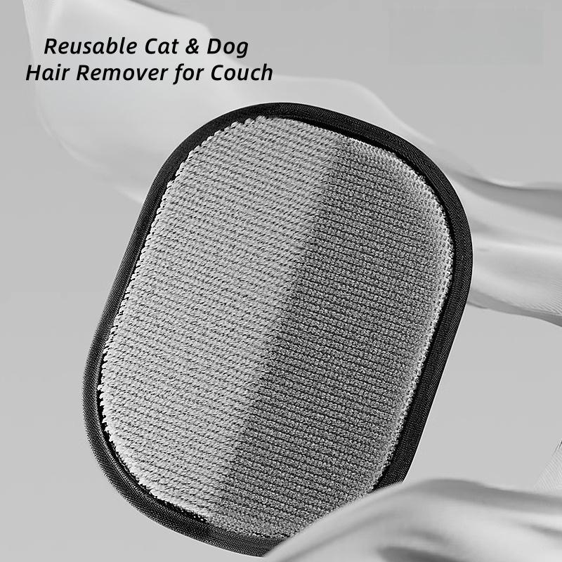 FurGlove being used on a fabric sofa to remove pet hair